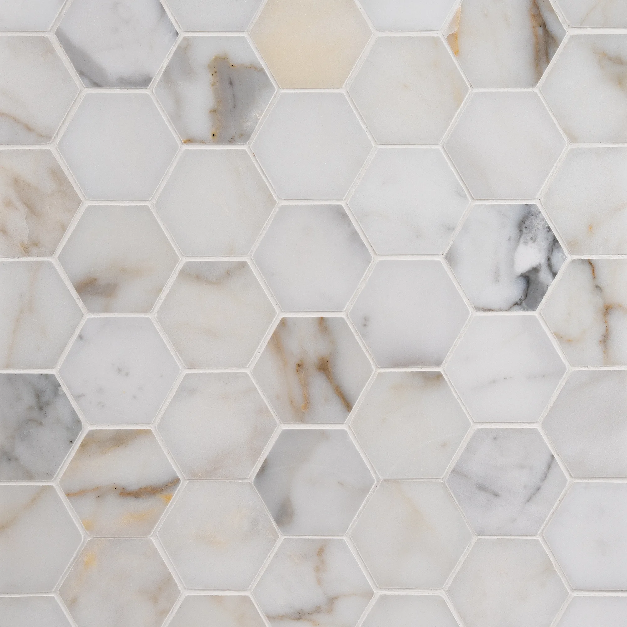calacatta-gold-hex-marble-mosaic Calacatta Gold 2x2 polished hexagon marble mosaic tile The Mosaic Shop