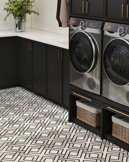 Hampton thassos calacatta gold and nero marquina marble mosaic tile installed on a laundry room floor