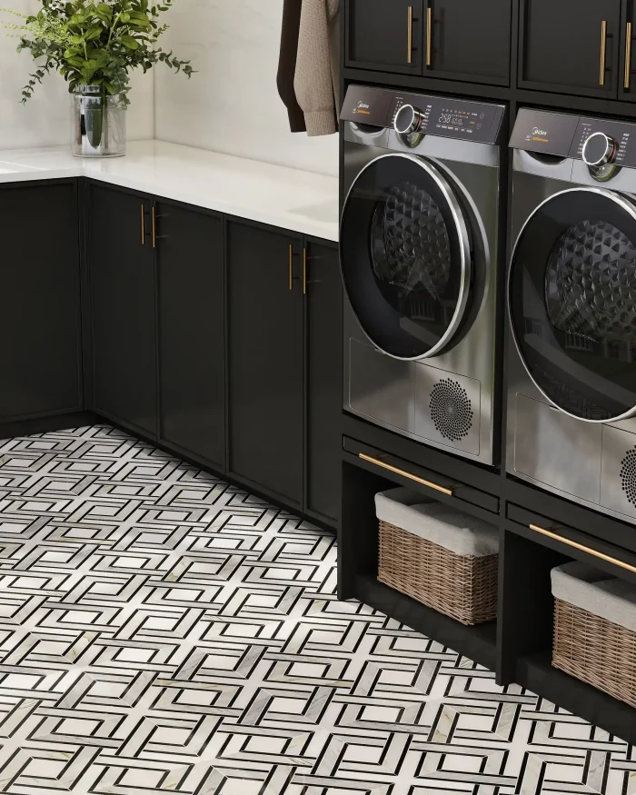 Hampton thassos calacatta gold and nero marquina marble mosaic tile installed on a laundry room floor