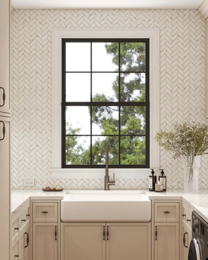Paradise Warm herringbone marble and mother of pearl mosaic tile installed as a laundry room backsplash