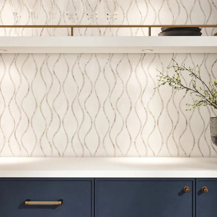 Close-up of Seaside White mosaic showing Thassos marble field and sinuous white mother of pearl strand detail