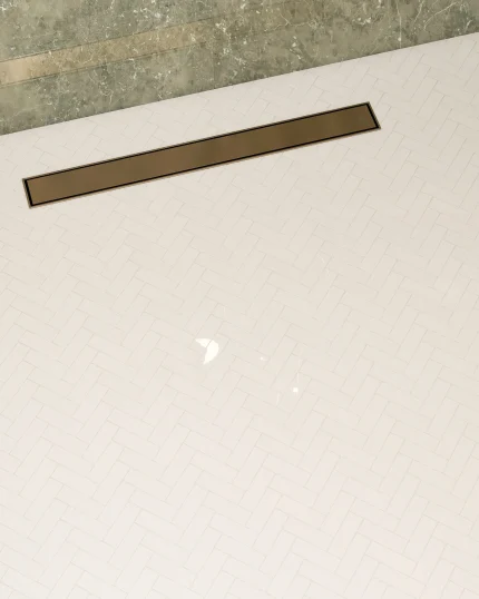 Thassos polished herringbone marble mosaic tile installed on a shower floor