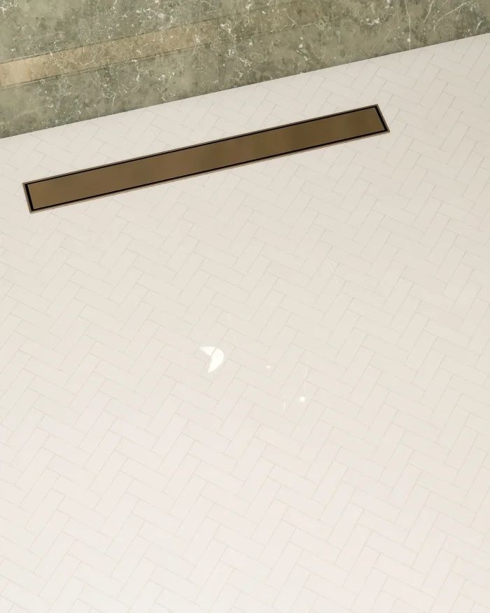 Thassos polished herringbone marble mosaic tile installed on a shower floor