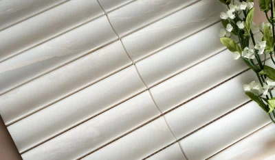 Close-up detail of natural stone mosaic tile lot variation